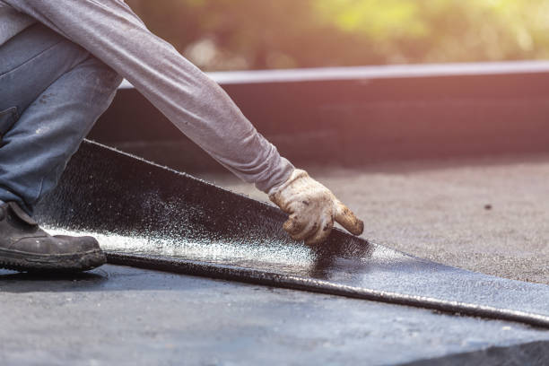 Professional Basement Waterproofing technician working in Townley, AL